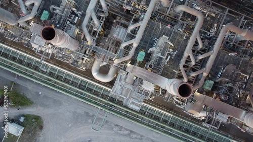 chemical industry pipes and machines produce emission caused by the production of polyolefins or other technology and chemicals engineerings shot from above  photo