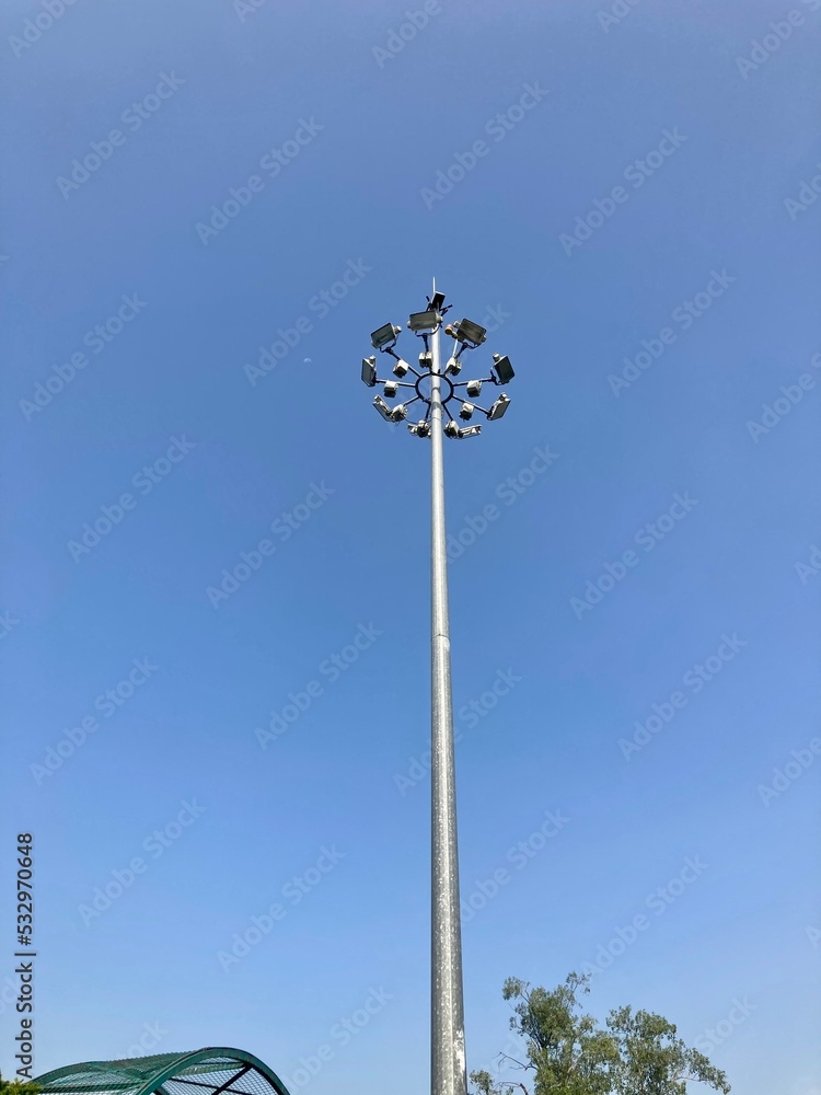 street light lamppost on a blue sky. daytime streetlight. lantern street lighting against day time sky. street lamp on metal pole. lamp street lighting is off. park lantern. old lamp city lighting