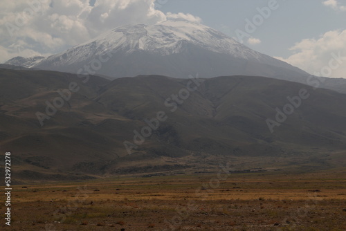 View of Mount Ararat (Agri) with snow-capped peak in light haze near the city of Dogubayazit, in Eastern Anatolia region, Turkey