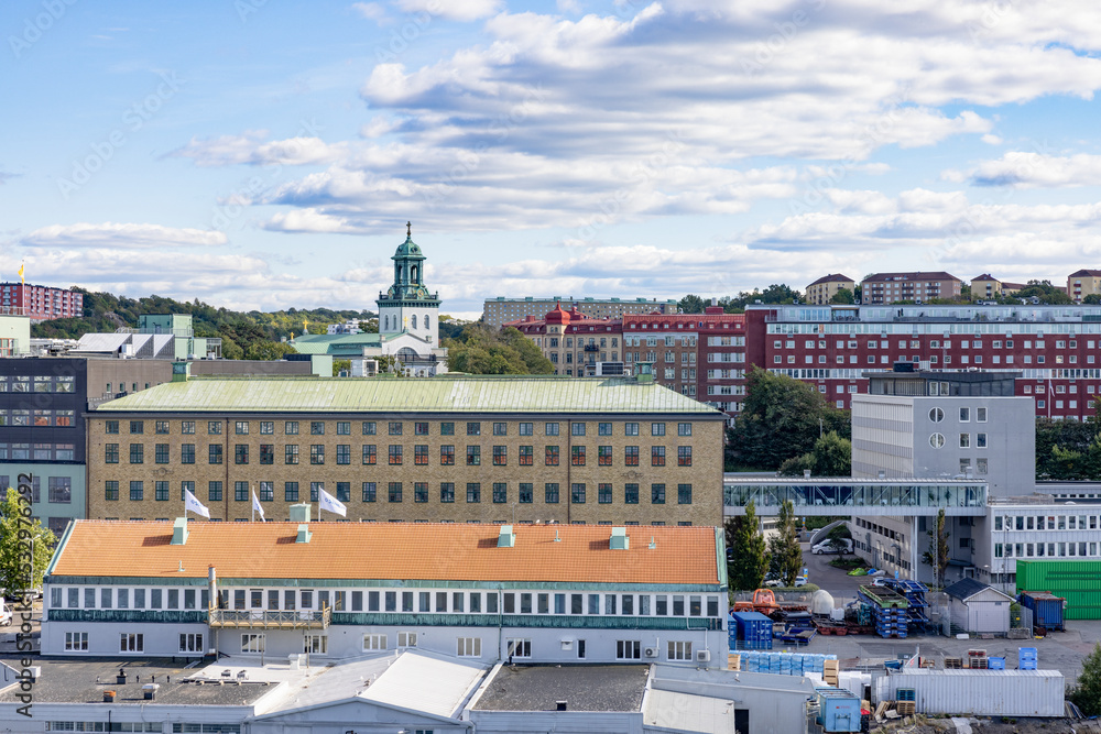 Naklejka premium View of Gothenburg harbor with residential buildings, office buildings and Tower of Carl Johan's Church.Carl Johan's Church is a Swedish parish church on Sagberget ,Sweden,Scandinavia,Europe,