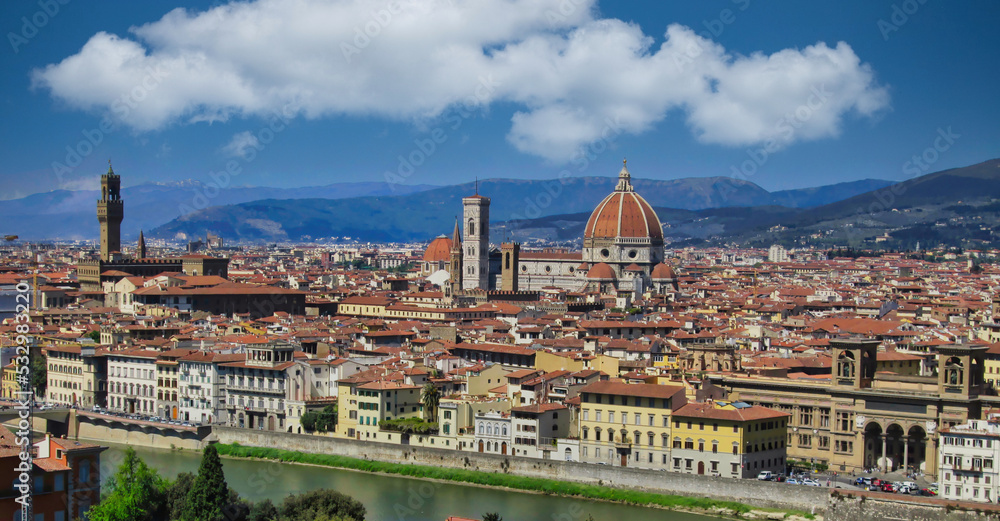 A beautiful shot of Florence downtown from Michelangelo Square under cloudy blue sky during the spring
