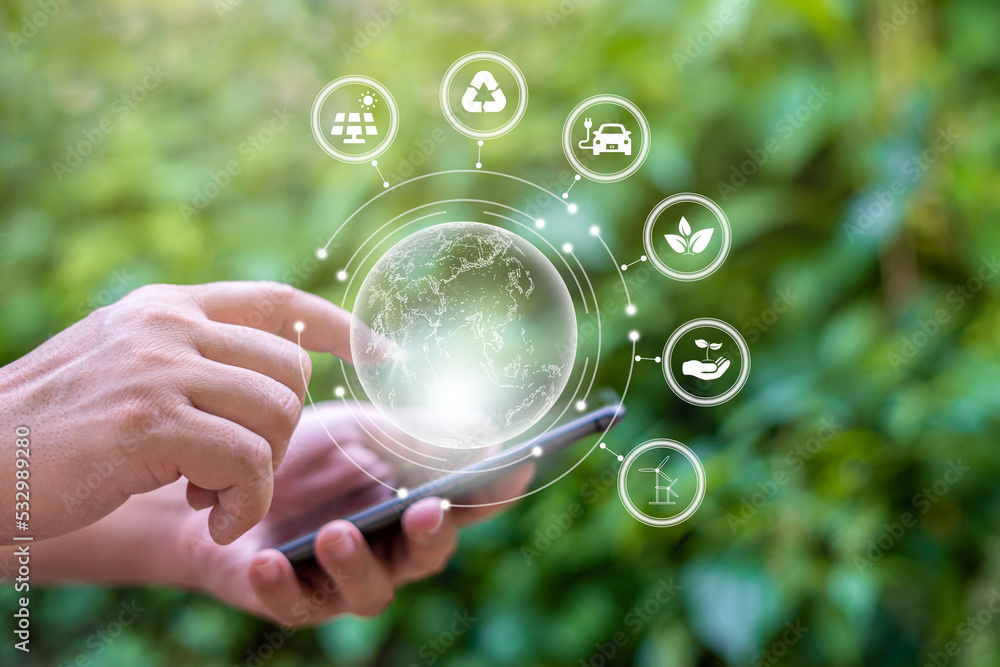 Human hand holding smartphone and green earth ESG icon environmental ...