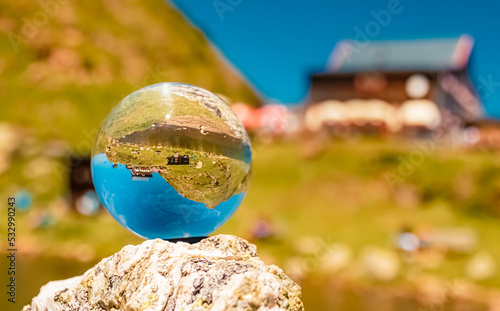 Crystal ball alpine landscape shot at the famous Wildseelodersee lake, Fieberbrunn, Tyrol, Austria photo