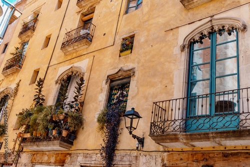 Barcelona, Spain-August 18, 2022. Brightly colored facade in the gothic quarter of Barcelona, Spain. Tourist Mediterranean city