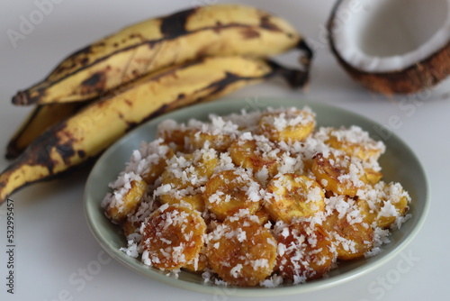 Ghee roasted ripe plantain slices, dipped in coconut sugar mixture