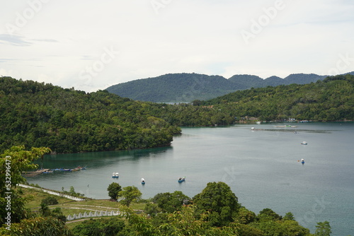 High angle view of coastline with island and hills