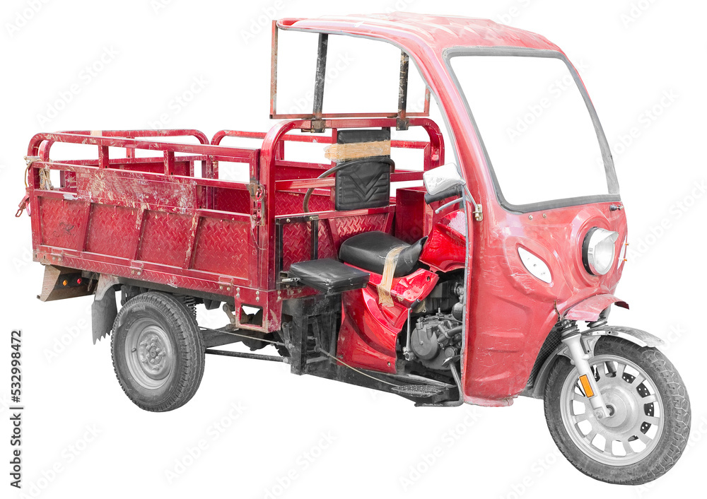 Old and damaged red three-wheeler with rear storage box isolated on white for easy selection