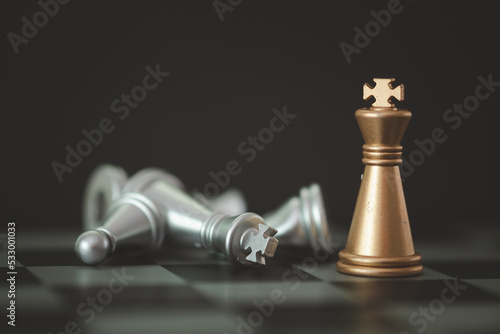 Canvas Print Golden knight stand as last winner over silver chess on chess board