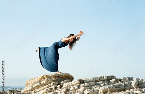 Beautiful Woman Sea Balance Yoga Pose
