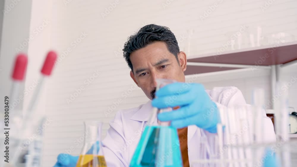 4K, Close-up of a bearded male science teacher preparing an experiment in preparation to teach students in a school science class. Concept education, Science experiments, Chemistry and Children 4K, Close-up of a bearded male science teacher preparing an experiment in preparation to teach students in a school science class. Concept education, Science experiments, Chemistry and Children