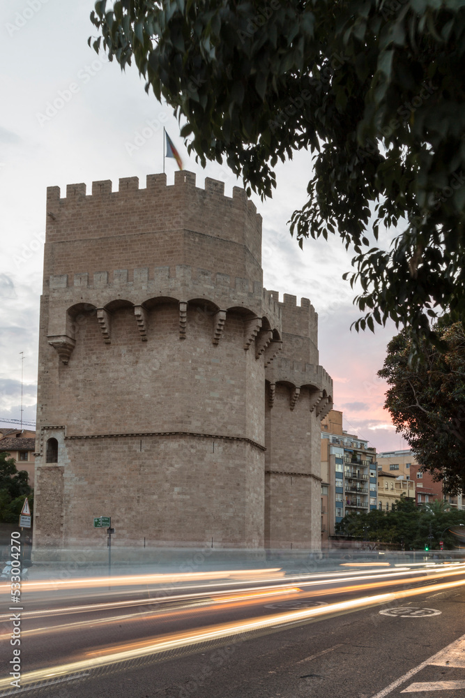 Side view of the Torres de Serrano in Valencia, Spain. To become night