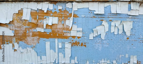 Old peeling paint on the wall. Abstract texture background.