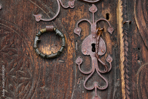old wooden door with forged ironwork