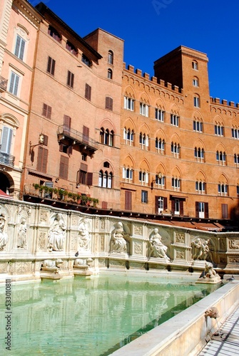 Fountain and building in Piazza del Campo, Siena Italy