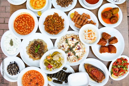 Table scene of assorted take out or delivery foods. Traditional Turkish cuisine. Various Turkish meal and appetizers. Top down view on a table.