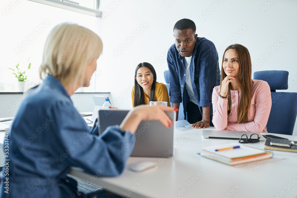 Female entrepreneur lead a meeting with group of diverse business people at startup office Female entrepreneur lead a meeting with group of diverse business people at startup office