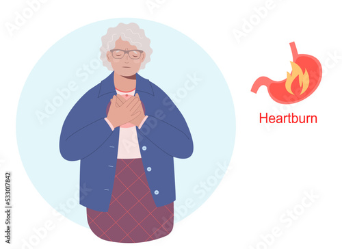 Elderly woman having a heartburn or stomach problem and suffering for this. Stomach acid reflux disease and digestive system problem.