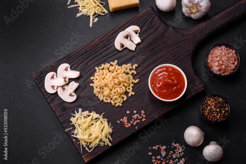 Raw pasta, mushrooms, onions, mince, spices and herbs to make a delicious paste