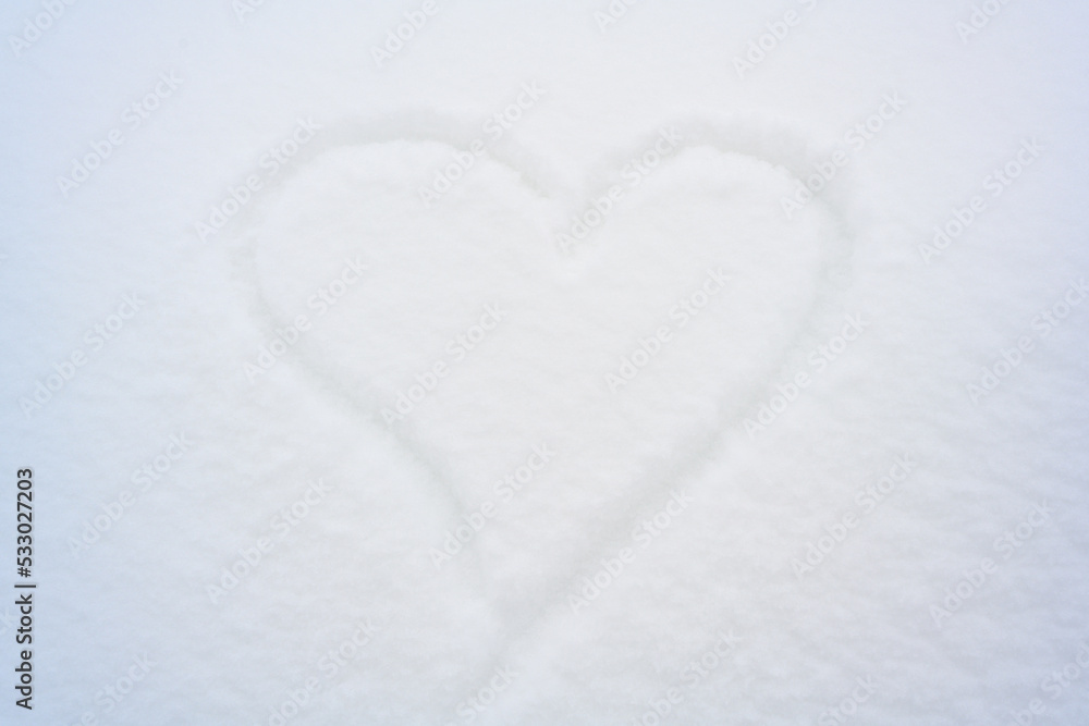 Snow heart as winter background.