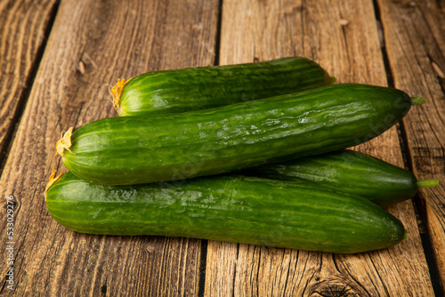 Cucumbers are green on a wooden background.Fresh vegetables. Sale.