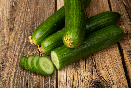 Cucumbers are green on a wooden background.Fresh vegetables. Sale.