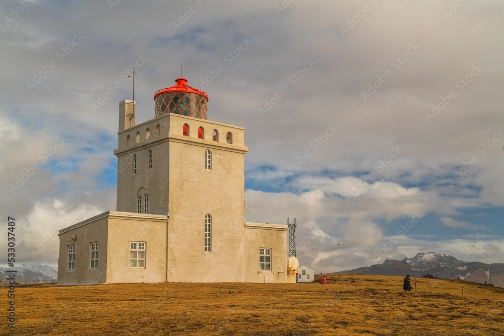 Dyrhólaey lighthouse is located on the central south coast of Iceland. Dyrhólaey lighthouse is located on the central south coast of Iceland.