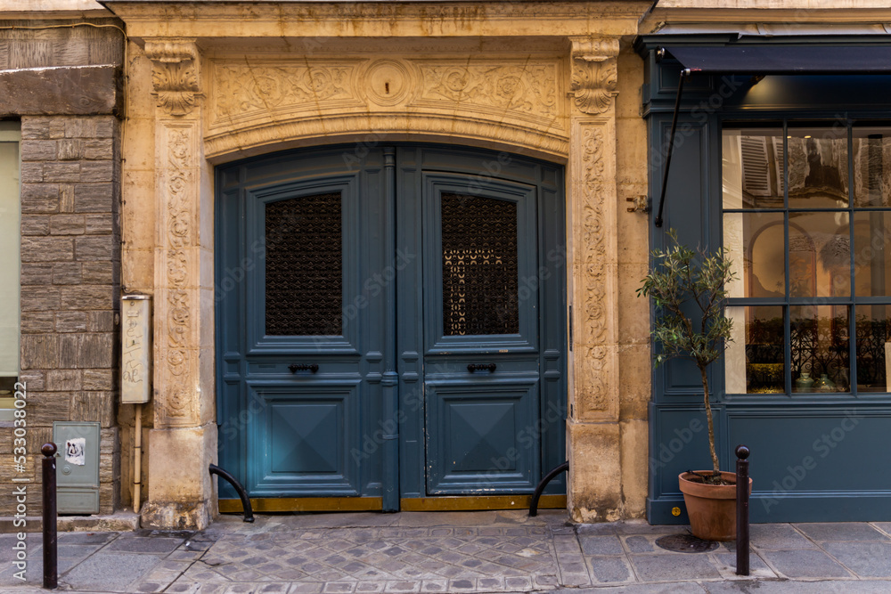 An old door in Paris on a sunny day. An old door in Paris on a sunny day.