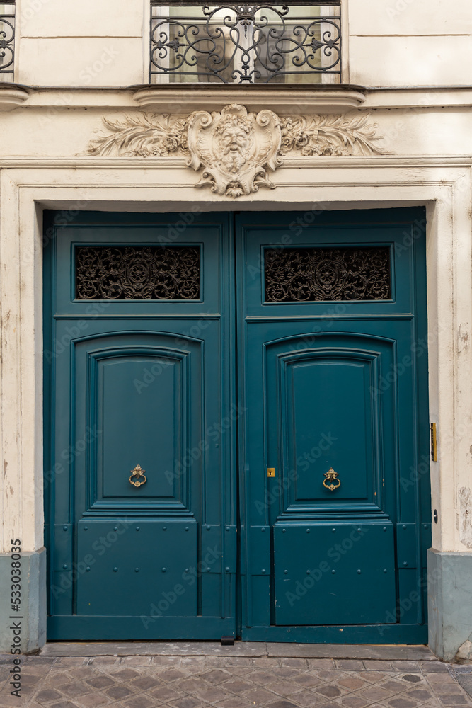 An old door in Paris on a sunny day.