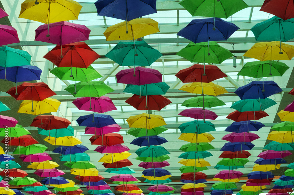 Obraz premium Colored umbrellas inside a mall