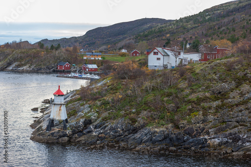 The little fishing village of Stokkneset in the narrow Stokksund strait between Stokkøya and the mainland, Åfjord Municipality, Trøndelag, Norway photo