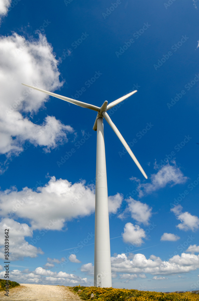 wind turbines against mountains and sky wind turbines against mountains and sky