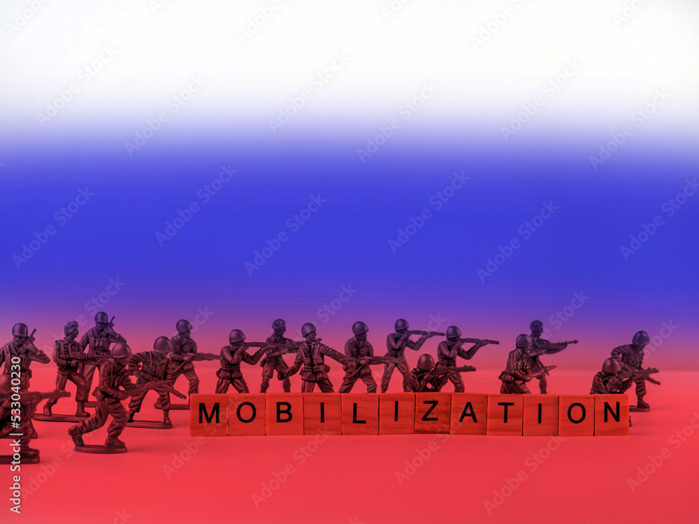 The word mobilization and soldiers on a light background. Mobilization in Russia.
