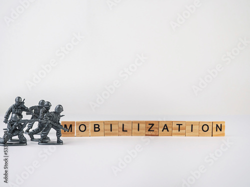 The word mobilization and soldiers on a light background. Mobilization in Russia. photo