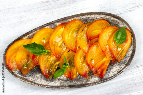 Tomato salad Pineapple sliced on a light gray background. photo