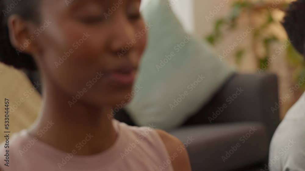 Relax, zen and a couple in meditation in living room of home. Health, spiritual wellness and balance, black woman and man meditate on yoga mats. Peace, calm and quiet breathing for happy lifestyle. Relax, zen and a couple in meditation in living room of home. Health, spiritual wellness and balance, black woman and man meditate on yoga mats. Peace, calm and quiet breathing for happy lifestyle.