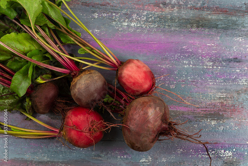 Red beets from the vegetable garden seen from above.on an old board. photo