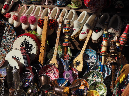 Albanian souvenirs, photo taken close up. Musical instruments, slippers, dishes. Gjiokastra, Albania. photo