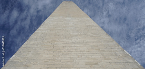 Washington monument from the base under blue sky
