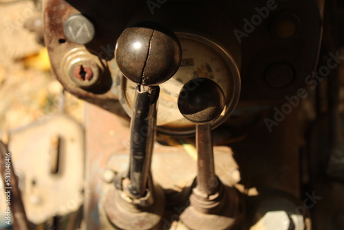 Two gear sticks of an old tractor