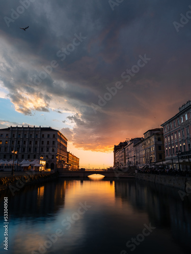 sunset over the river in Triest, italy