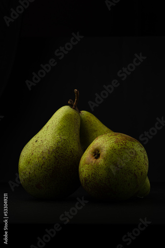pears on black background