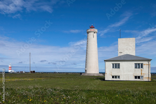 Gardskagi Lighthouse located in Keflavik, Iceland with Old Gardur Lighthouse in the background © Lori Labrecque