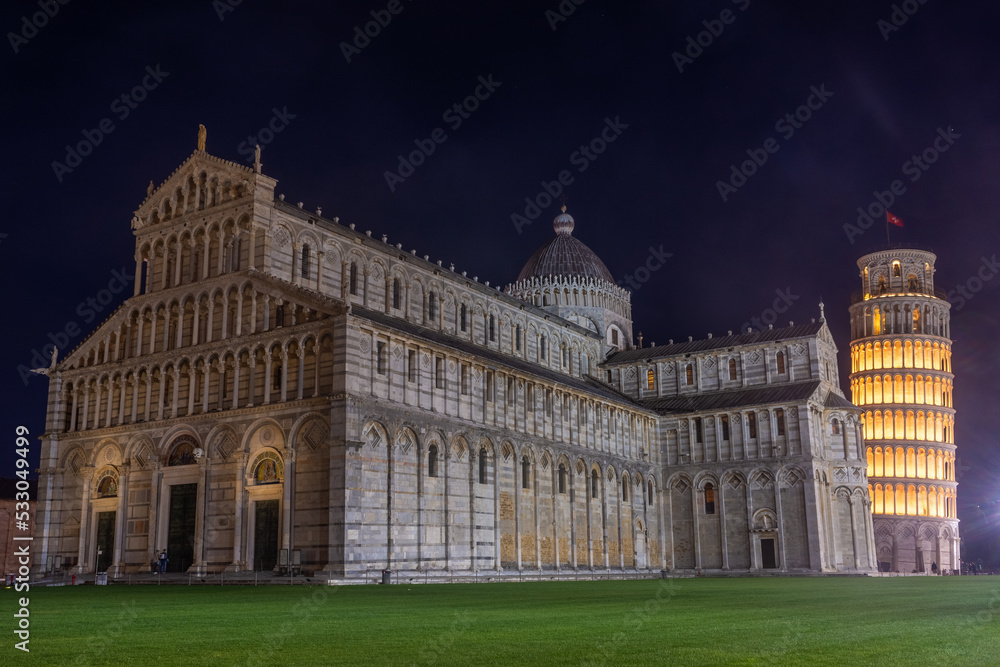 Pisa, Italy,  14 April 2022: Cathedral and leaning tower by night