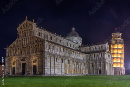 Pisa, Italy,  14 April 2022: Cathedral and leaning tower by night