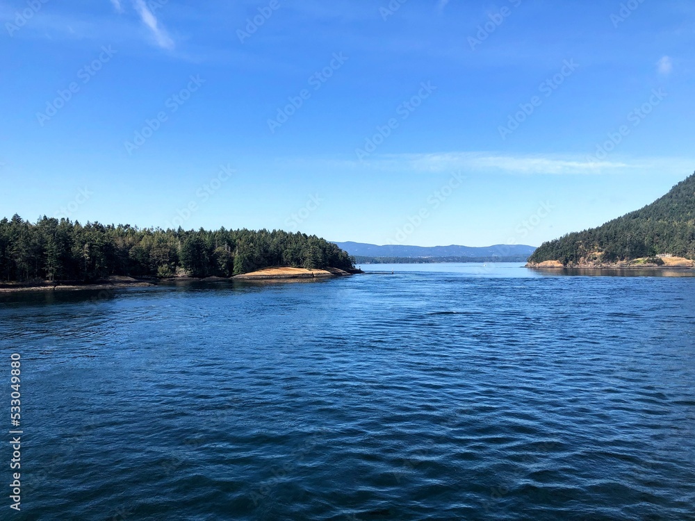 A view of active pass, a common BC Ferries route through the gulf islands, on a beautiful sunny summer day outside of Vancouver, British Columbia, Canada