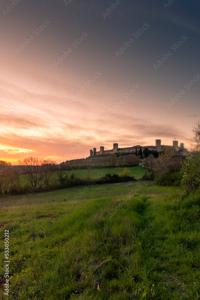 Sunset over the medieval fortified town of Monteriggioni, Tuscany,  Italy