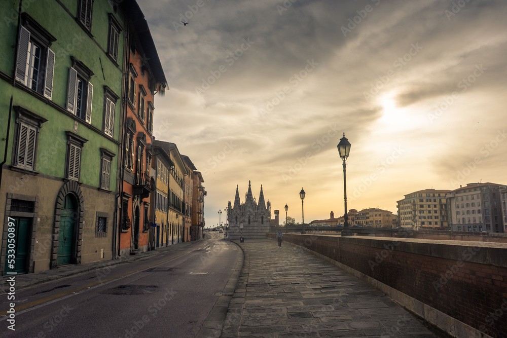 Fototapeta premium Pisa, Italy, 14 April 2022: Banks of the Arno River