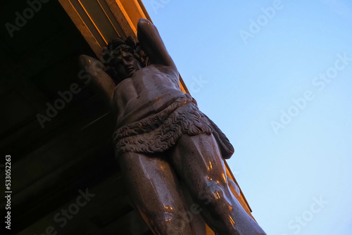 Marble statue of Atlant hold ceiling of New Hermitage, St. Petersburg, Russia photo