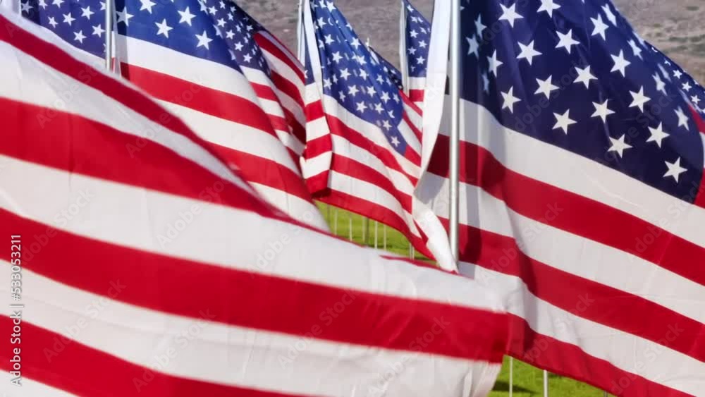 Patriotic display honoring victims of the terrorist attacks of September 11, 2001. Aerial close-up view of Waves of Flags ceremony with placed American and other flags. High quality FullHD footage Patriotic display honoring victims of the terrorist attacks of September 11, 2001. Aerial close-up view of Waves of Flags ceremony with placed American and other flags. High quality FullHD footage