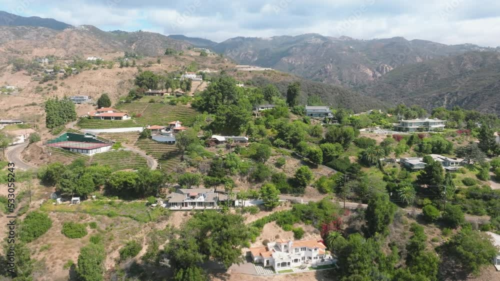 Drone shot of astonishing natural environment with hilly landscape. Charming beach houses along steep slopes of the valley as seen from above. High quality 4k footage Drone shot of astonishing natural environment with hilly landscape. Charming beach houses along steep slopes of the valley as seen from above. High quality 4k footage